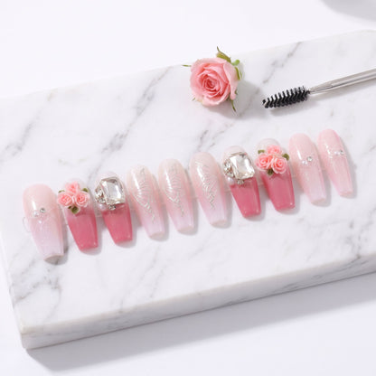 Blushing Rosé press-on nails with pink ombré, rose flowers, butterfly line art and crystals
