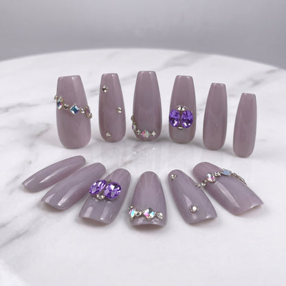 Indigo Pearl handmade press-on nails in muted lilac with purple gems and crystal accents